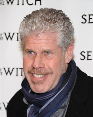 Distinguished Actor Ron Perlman Donning A Stylish Scarf. Wallpaper