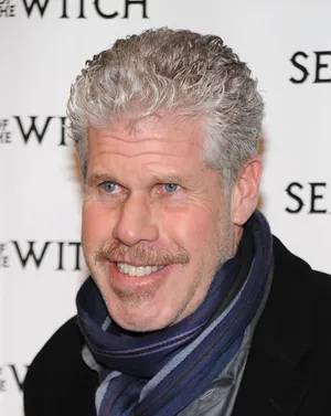 Distinguished Actor Ron Perlman Donning A Stylish Scarf. Wallpaper