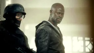 Djimon Hounsou With Armed Man Wallpaper