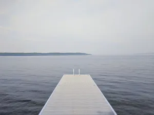 Dock At A Calming Lake Scenery Wallpaper