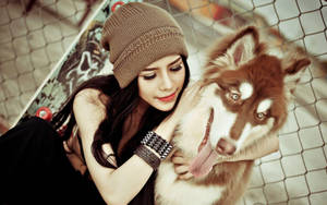 Dog And Girl Hugging A Siberian Wallpaper