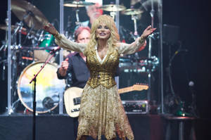 Dolly Parton All-gold Outfit Wallpaper