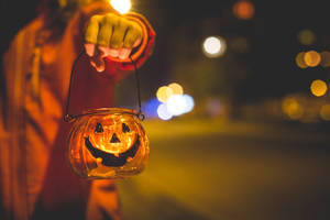 Download Little Girl Holding Halloween Candle Holder Free Stock Photo Wallpaper