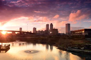 Downtown Tulsa With Body Of Water Wallpaper