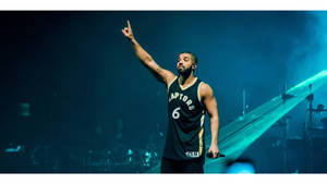 Drake Rocking In His Ovo Raptors Jersey Wallpaper