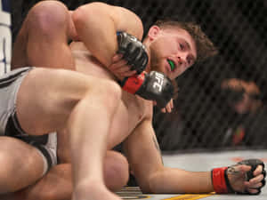 Dricus Du Plessis Tackling Opponent Wallpaper