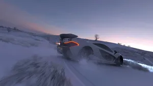 Drifting Racing Car In Snow Wallpaper