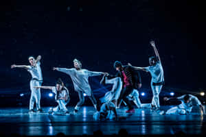 Dynamic_ Hip Hop_ Dance_ Performance_ Under_ Spotlights Wallpaper