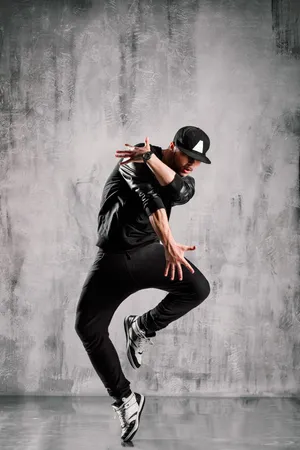 Dynamic Hip Hop Dancerin Action.jpg Wallpaper