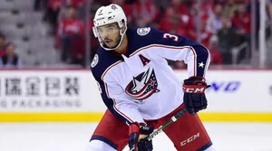 Dynamic Hockey Player Seth Jones In Action Wallpaper