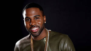 Dynamic Pop Star Jason Derulo In Live Performance Wallpaper