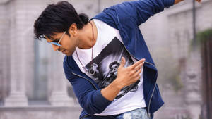 Dynamic Ram Charan In Full Swing - A Candid Shot From A Street Dance Scene. Wallpaper