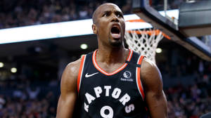 Dynamic Serge Ibaka In Action For Toronto Raptors Wallpaper