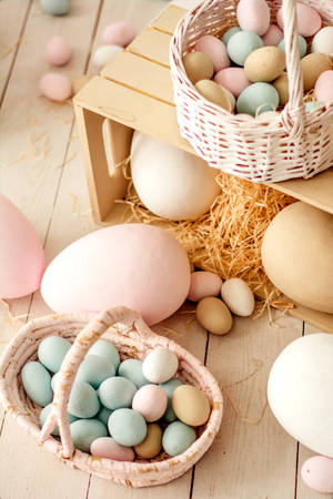 Easter Eggs In Baskets On A Wooden Table Wallpaper