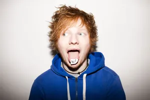 Ed Sheeran Performs A Comedic Facial Expression. Wallpaper