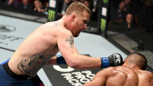 Edson Barboza Delivering A High Flying Roundhouse Kick During A Ufc Fight. Wallpaper