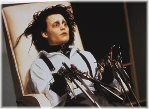 Edward Scissorhands Sitting On A Chair Wallpaper