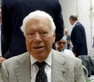 Elderly_ Gentleman_ At_ Event Wallpaper