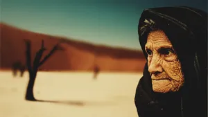Elderly Woman In Desert Wallpaper