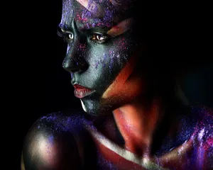 Elegant Afro Woman Showcasing Vibrant Makeup Wallpaper