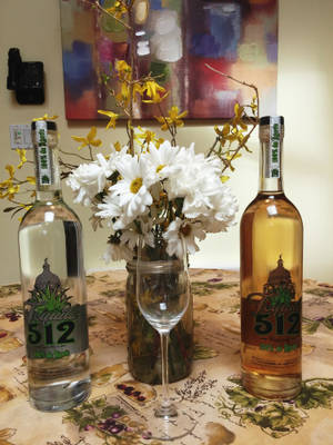 Elegant Bottle Of Tequila 512 With Distinctive Grey And Yellow Label Wallpaper