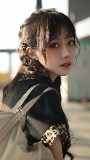 Elegant Japanese Woman Glance Wallpaper