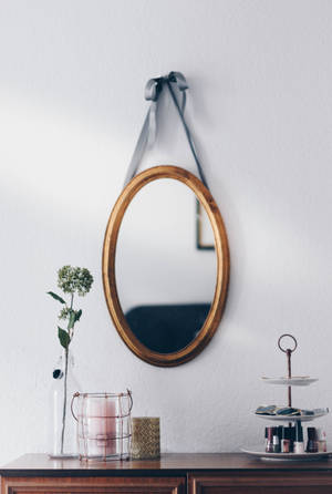 Elegant Oval Wooden Hanging Mirror Wallpaper