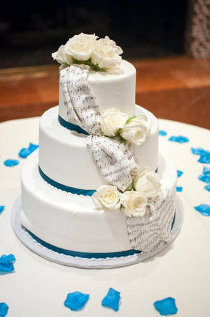 Elegant Tiered White Rose Wedding Cake Wallpaper