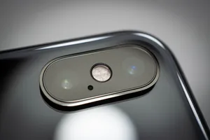 Elegant View Of Iphone Xs In Water Wallpaper