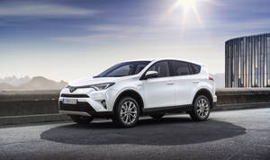 Elegant White Toyota Rav4 - Side View Wallpaper