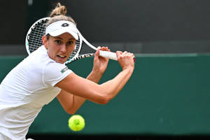 Elise Mertens In Action During A Tennis Match Wallpaper