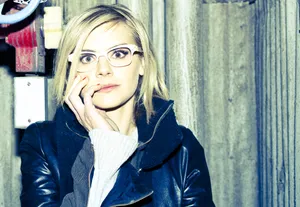 Eliza Coupe Striking A Pose In A Beautiful Setting Wallpaper