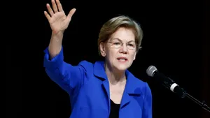 Elizabeth Warren Waving In Blue Coat Wallpaper