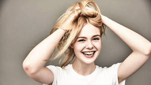 Elle Fanning Tying Hair Wallpaper