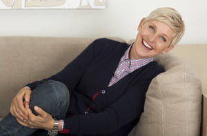 Ellen Degeneres Seated On A Couch Wallpaper