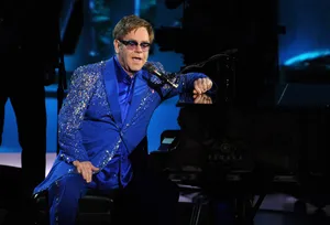 Elton John In Blue Glittered Suit Wallpaper