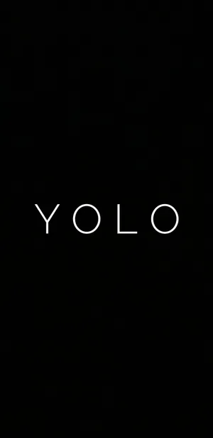 Embrace Life With 'yolo' Motivation On A Black Backdrop Wallpaper