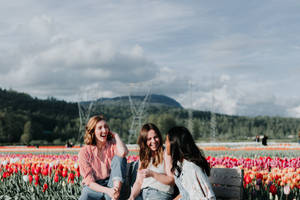 Embracing Sisterhood And Beauty Of Nature Wallpaper