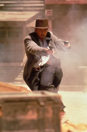 Emilio Estevez In Intense Gun Scene From 'dollar For The Dead' Wallpaper