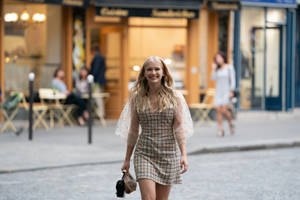 Emily And Camille Enjoying A Stroll Around Paris Wallpaper