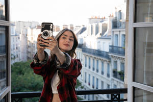 Emily In Paris Capturing Her Vacation Memories In A Selfie Wallpaper