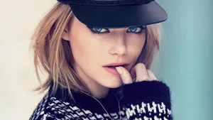 Emma Stone Looking Stylish In A Black Cap Wallpaper