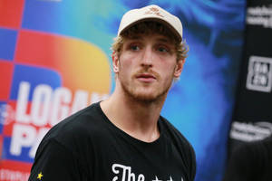 Emotional Logan Paul Beige Cap Wallpaper