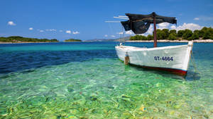 Empty Boat On Gradient Water Wallpaper