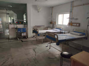 Empty Public Clinic Hospital Bed Wallpaper