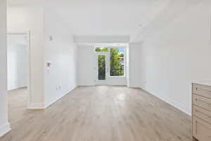 Empty Room With Single Cabinet Wallpaper