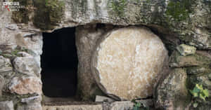 Empty Tomb With A Circular Door Wallpaper