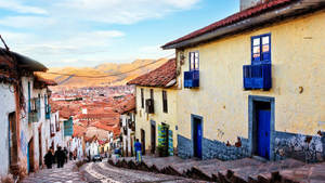 Enchanting Cobblestone Street In Cusco, Peru Wallpaper