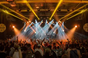 Energetic Crowd At A Music Festival Wallpaper