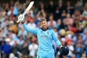 England Cricketer Joe Root In Action Wallpaper